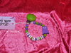 Pacifier chain with the name "Owl-green / purple"