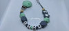Pacifier chain silicone raccoon gray / mint